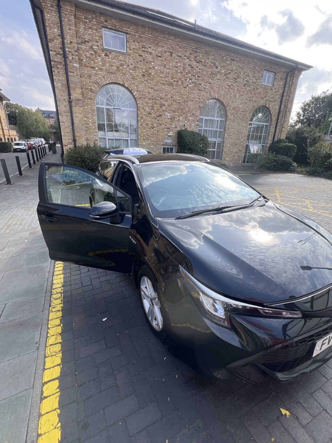 Black Toyota Corolla Estate used by Eddie's Taxi